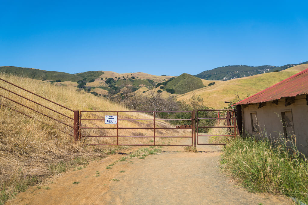 A brown metal gate for Poly Canyon Gate One