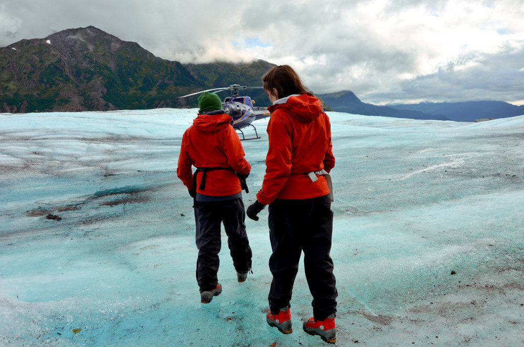 Returning to the helicopter to leave the glacier
