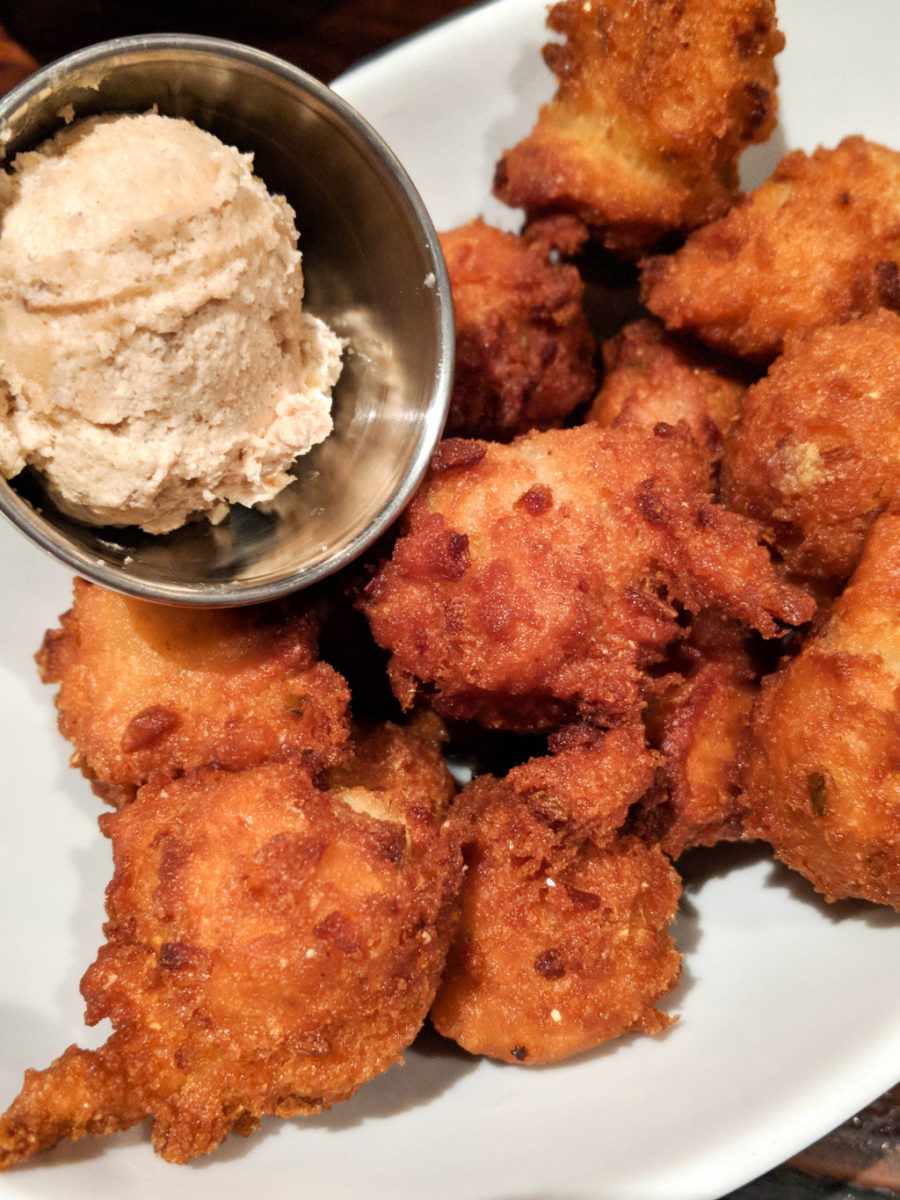 Hush puppies and butter in a dish