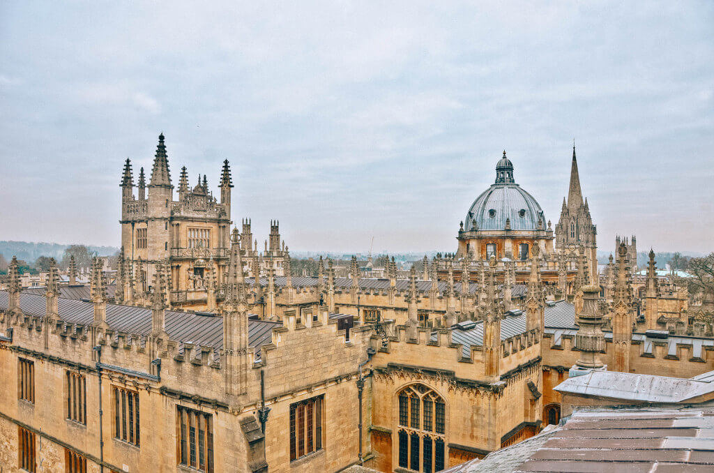 View from the roof of the Sheldonian Theatre over the stone buildings and spires of Oxford