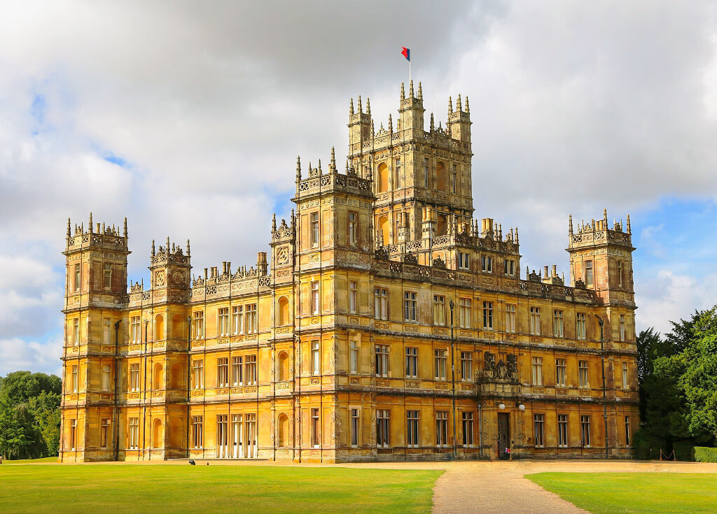 The impressive stone walls and towers of Highclere Castle