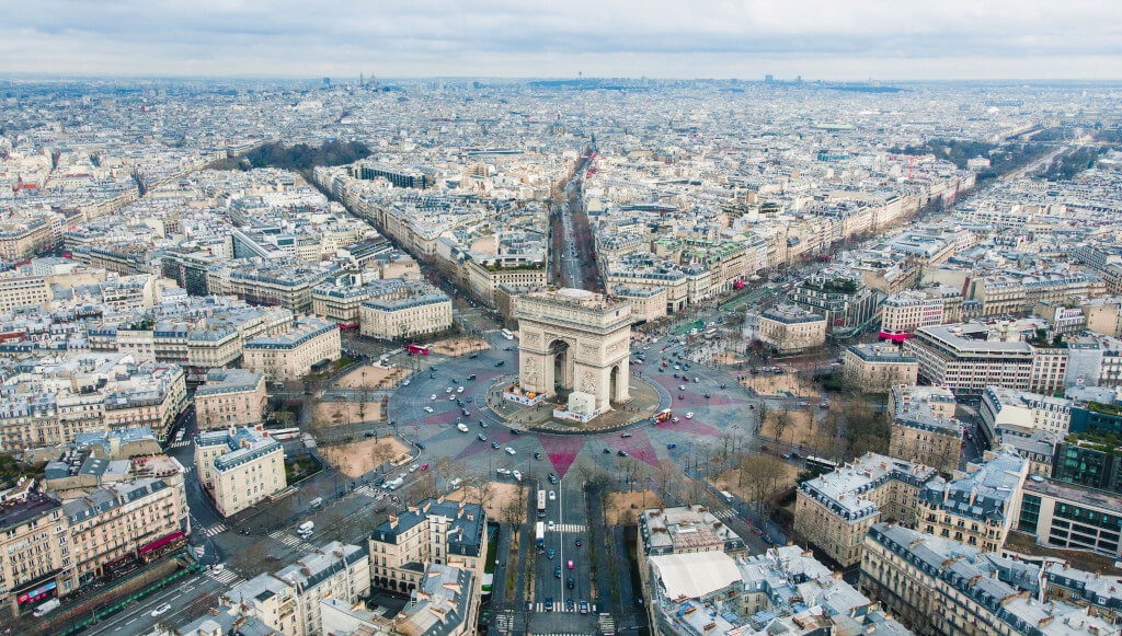 Aerial view of the Arc de Triomphe and geometrically arranged surrounding buildings
